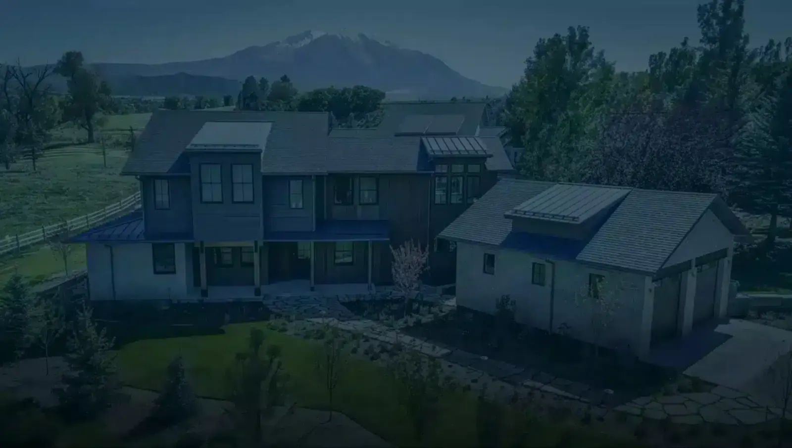 Aerial view of an Aspen custom home with mountain views
