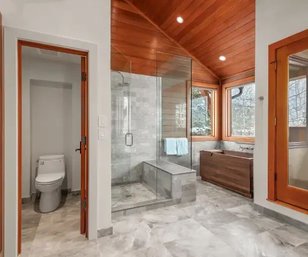 Bathroom with cedar ceiling, glass shower and water closet