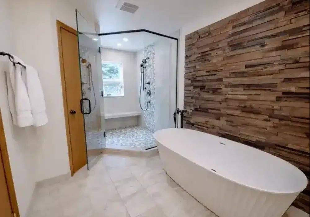 Freestanding tub beside a reclaimed wood accent wall