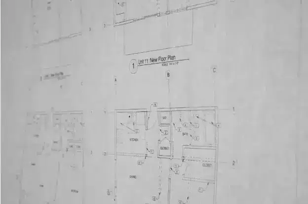 Black-and-white close-up of a printed floor plan drawing for a remodel