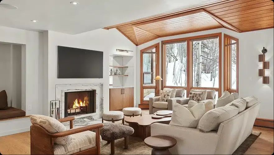 Remodeled Snowmass Village living room with cedar ceiling and fireplace