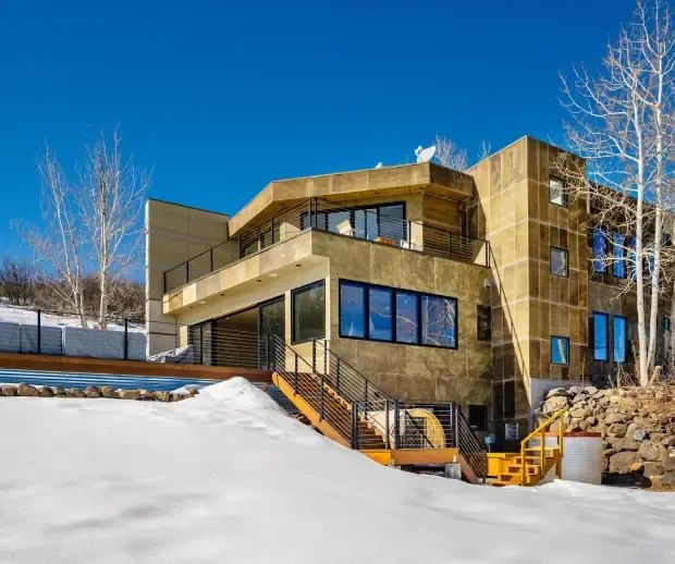 Modern multi-level home with decks in winter
