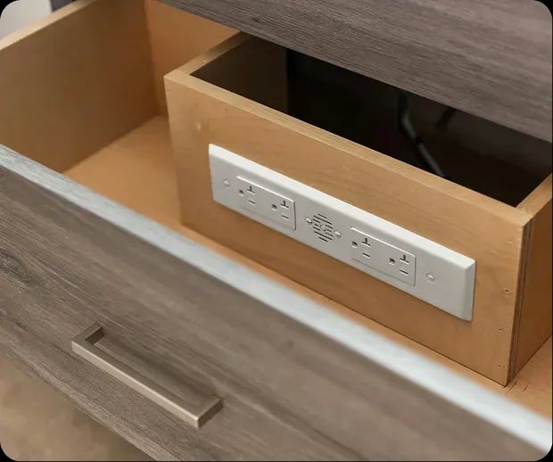 Cabinet drawer with a built-in charging outlet