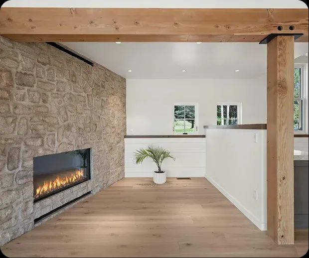 Stone accent wall with linear fireplace in a new Carbondale custom home