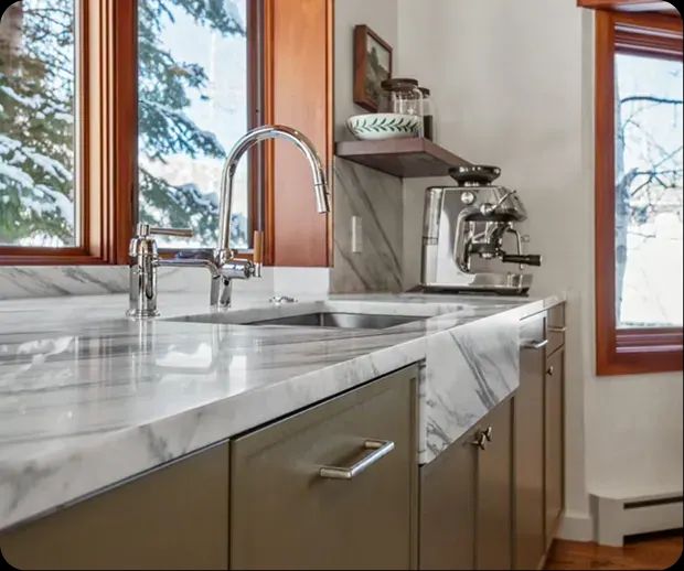 Marble island sink and espresso station by the window