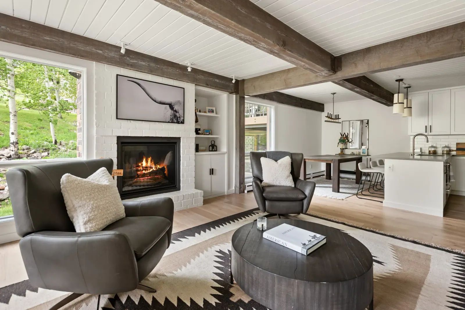 Living room with beamed ceiling and fireplace